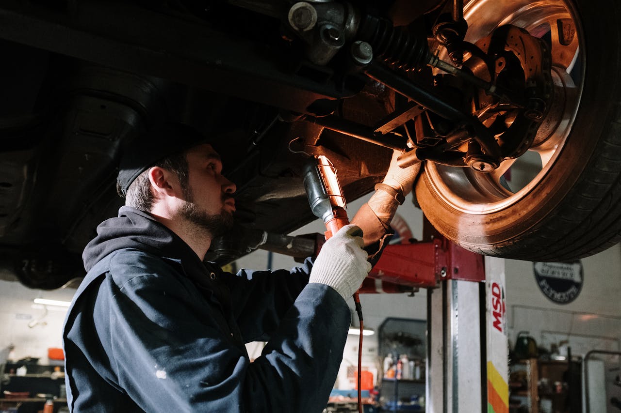 Mechanic examining car